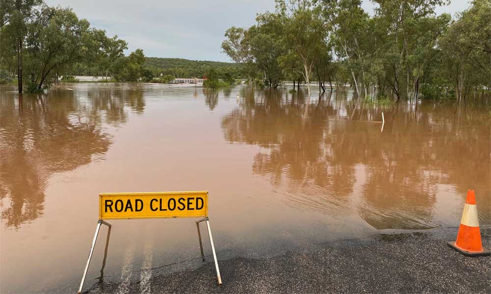 car driving through flood water