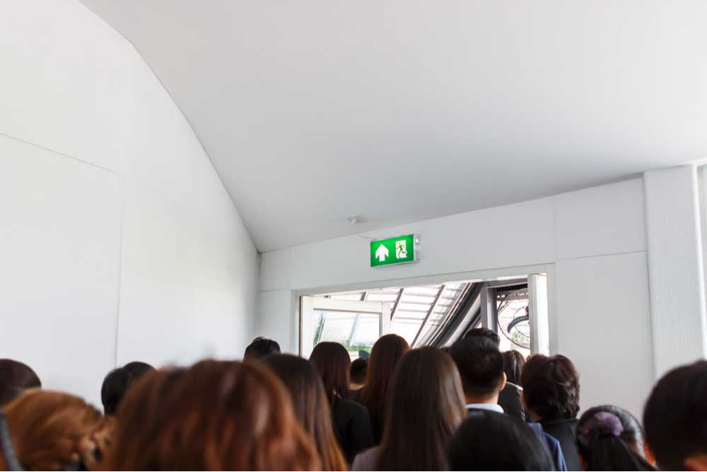 people walking towards exit